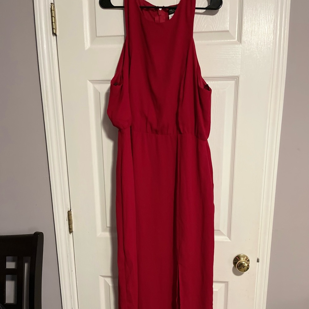 Cute red dress with side split. Hot item. Will go fast.